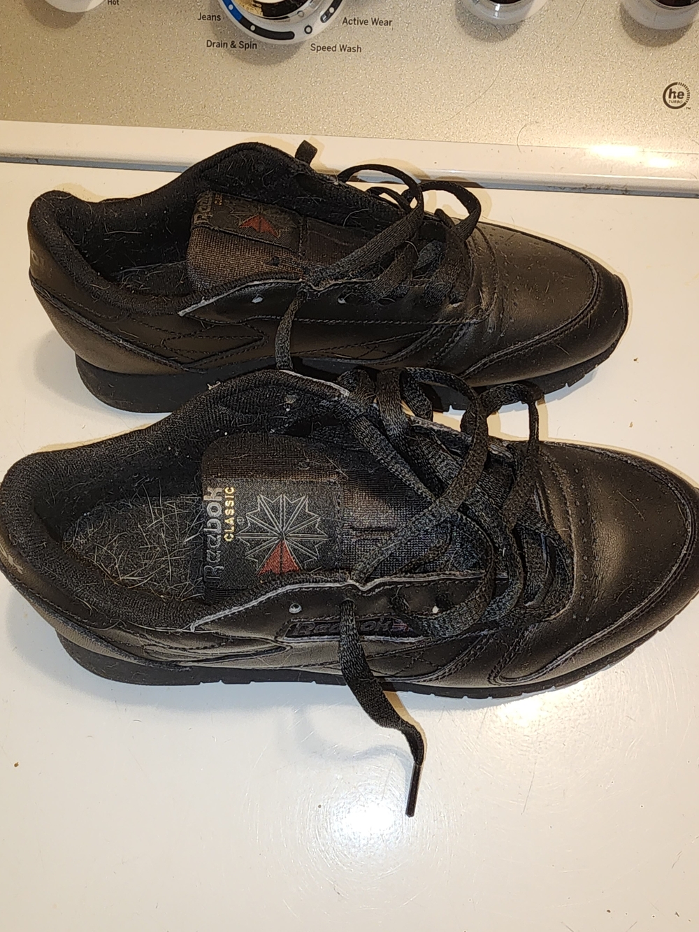 Reebok Men's Black Leather Lace-Up Sneakers with Subtle Red Accent